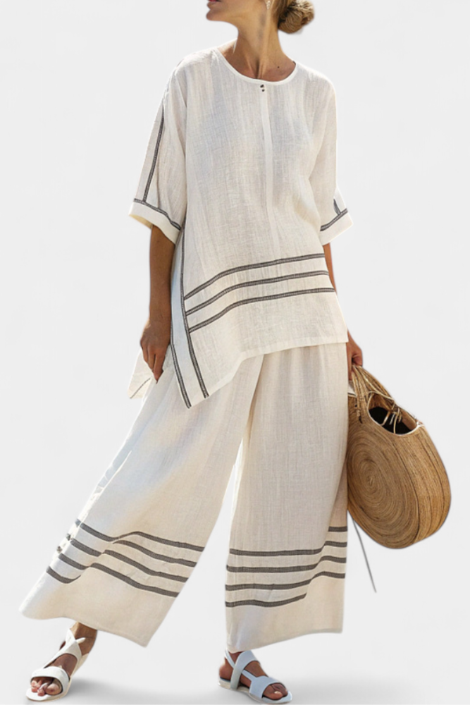 Vittorina – sophisticated striped asymmetric top and bold trousers